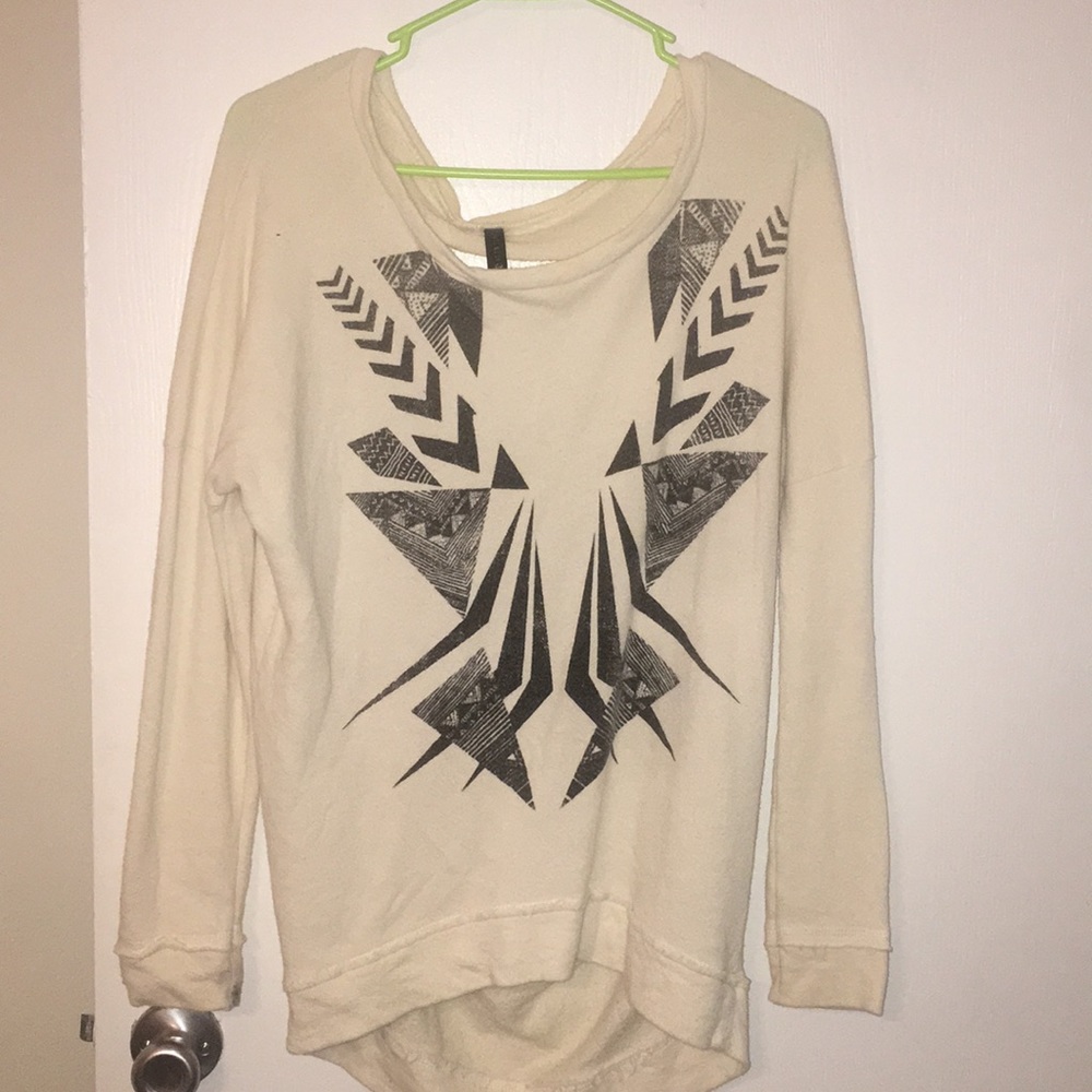Tilly’s long sweater with rips in the back